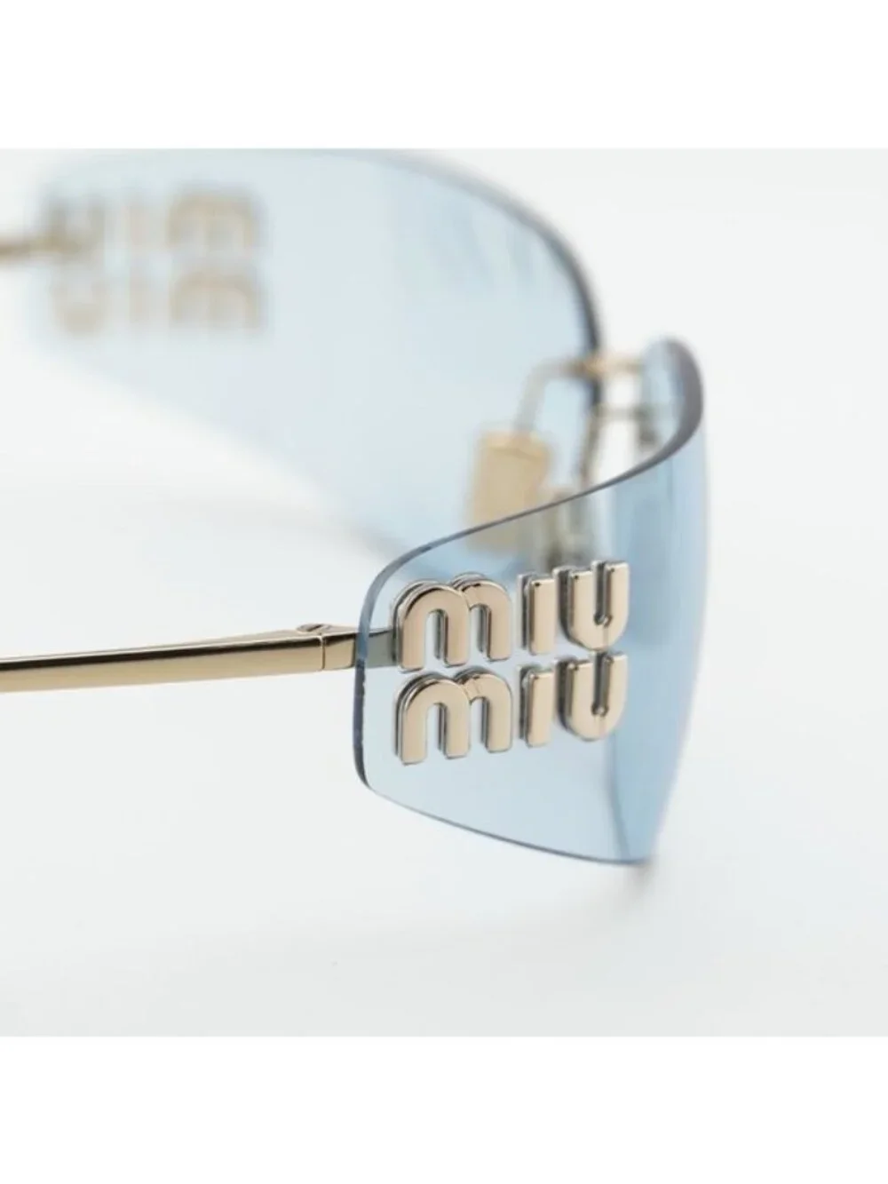 Miu Miu MUA51S ZVN10P Sunglasses Pale Gold Rectangle Frame, Light Blue Lenses